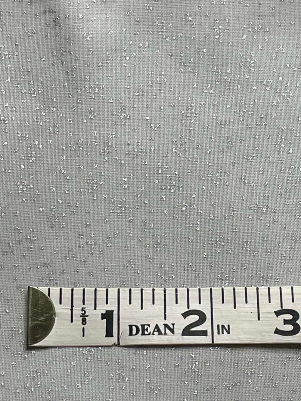 Timeless Treasures "First Frost" metallic gray fabric.  Sold by the yard.